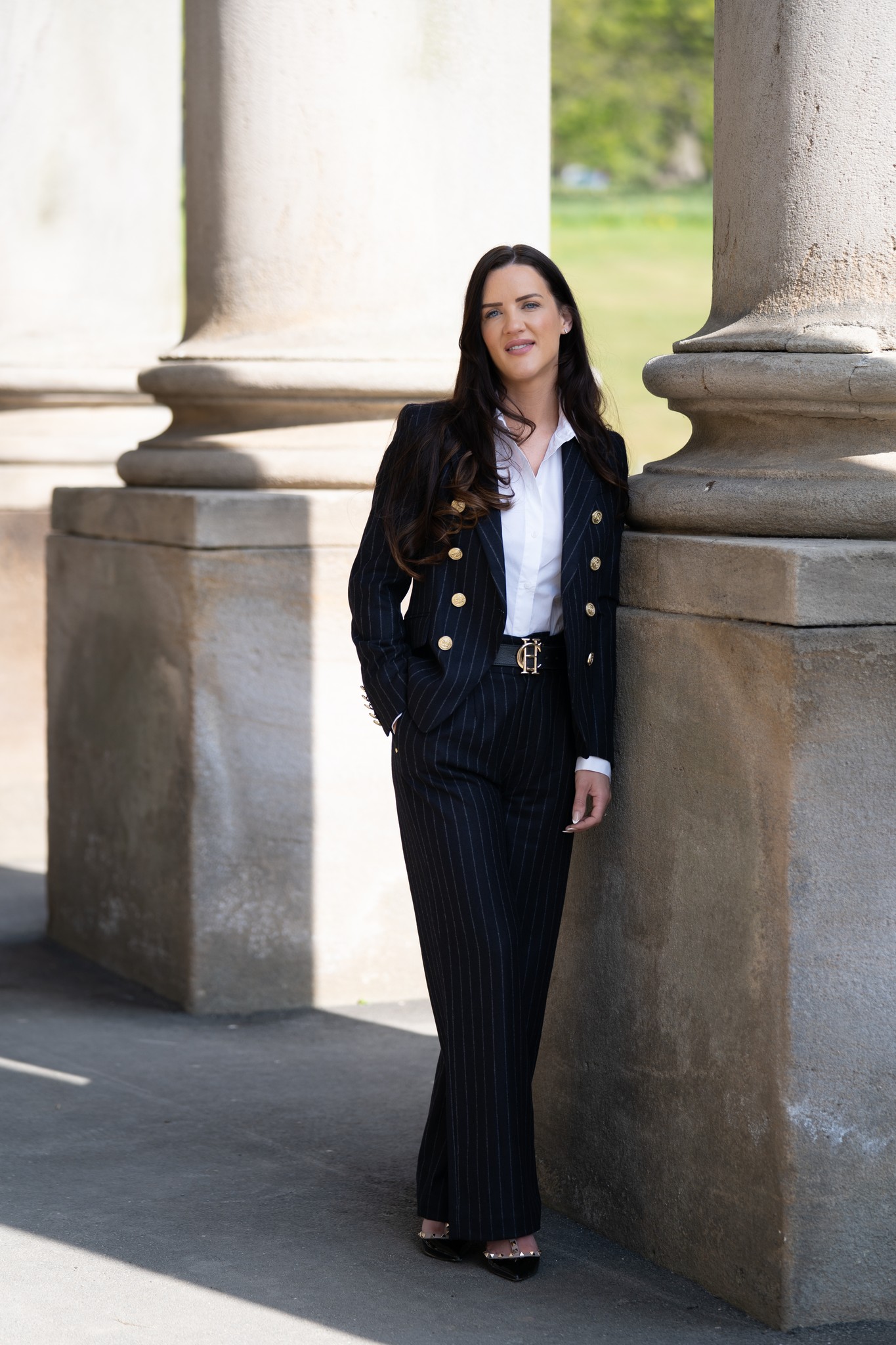 Businesswoman photographed against architecture