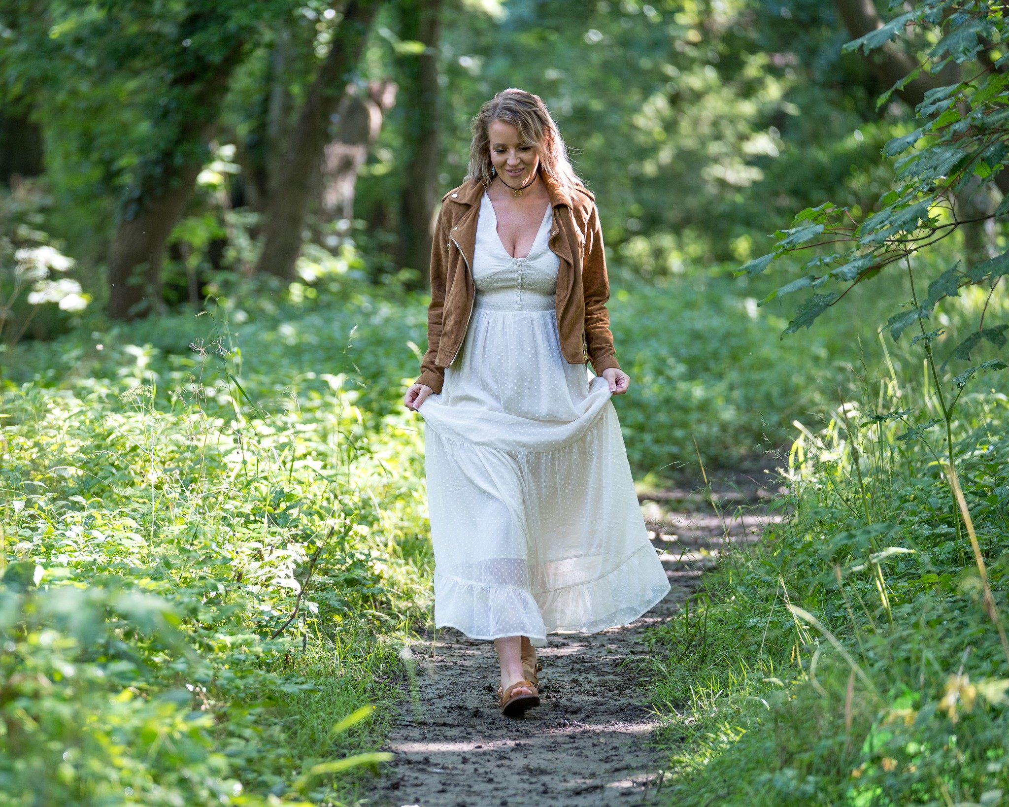 Coach walking through woodland during a personal branding shoot