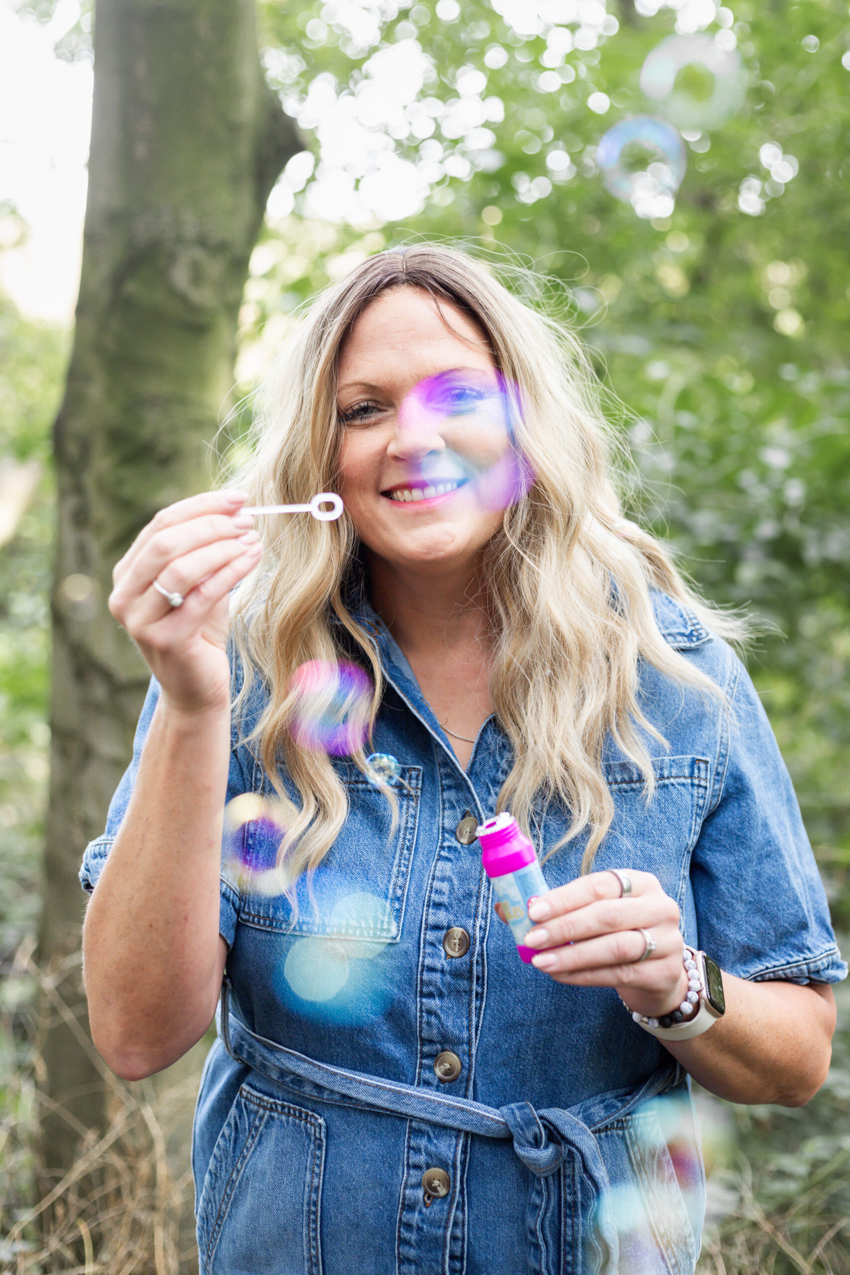 Sarah Johnson blowing bubbles during a creative portrait session