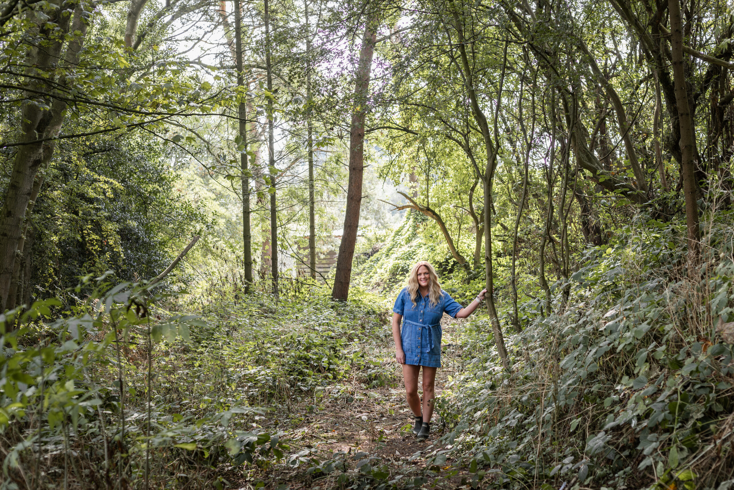 Sarah Johnson walking through woodland in County Durham